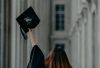 a woman in a graduation cap and gown